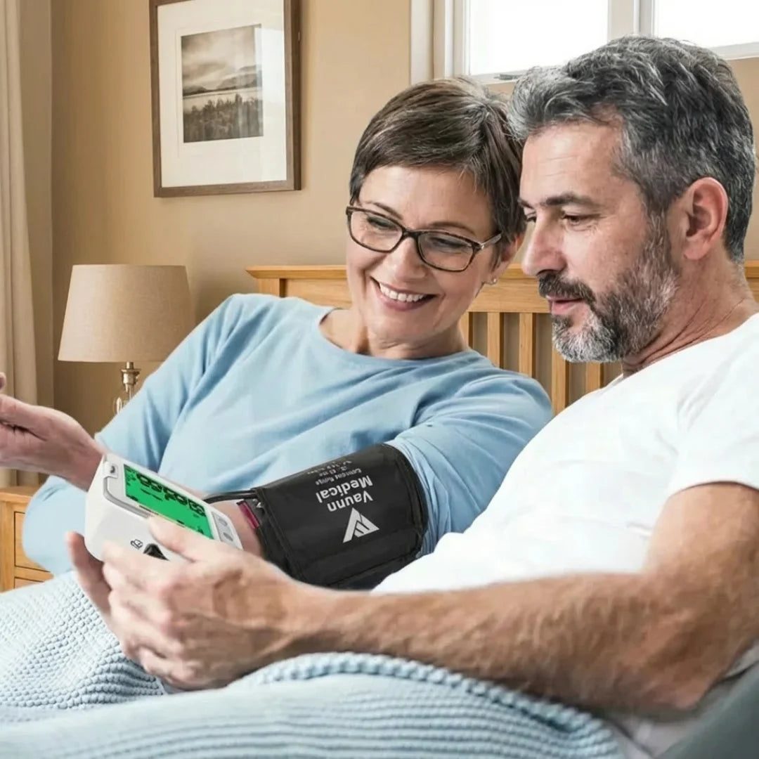 Couple checking blood pressure at home